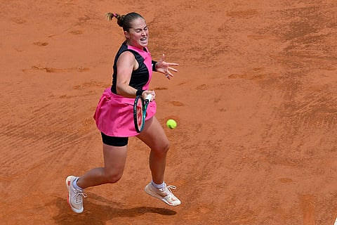 Jelena Ostapenko returns the ball to Aryna Sabalenka